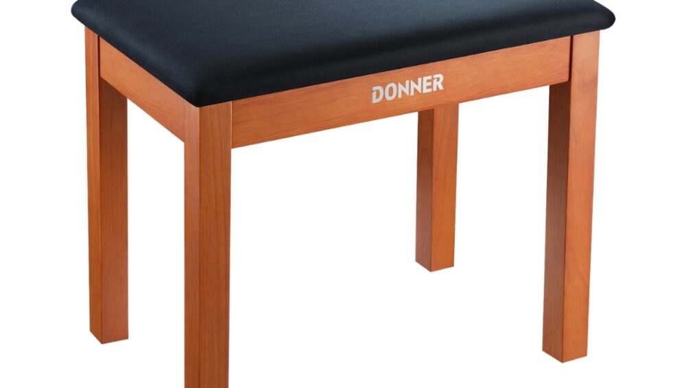 EC2088 by Donner is a wooden piano bench stool with music storage, featuring a classic design in a natural wood color.