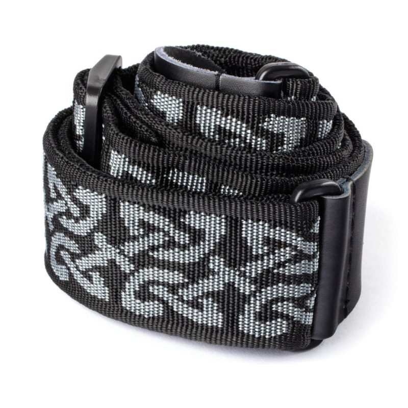 A guitar strap featuring a stylish black and grey patterned design.