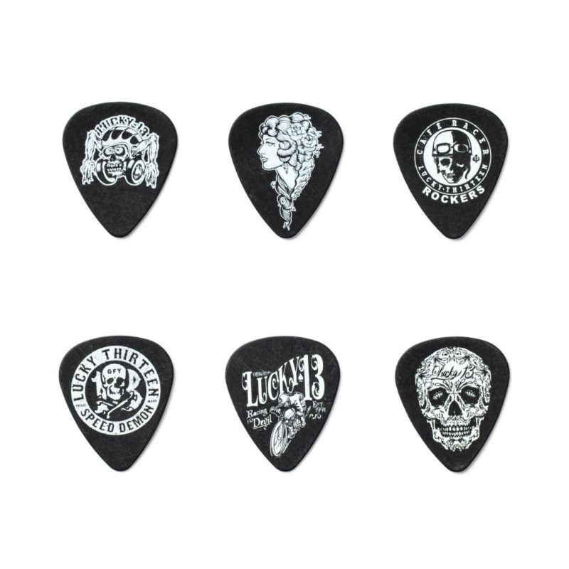 A collection of six guitar picks adorned with skull graphics, perfect for adding a bold touch to any guitarist's gear.