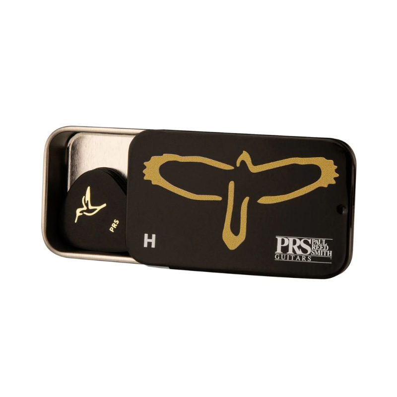 A collection of PRS T-Bird Hard Size guitar picks displayed on a surface, showcasing various colors and designs.