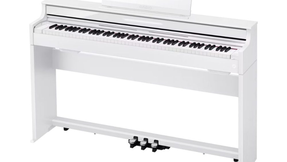 White Casio Celviano AP-S450 Slim Console Digital Piano on a white background, showcasing its sleek design.