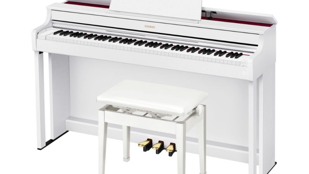 White Casio Celviano AP-300 Console Digital Piano with bench. Displayed prominently, showcasing its sleek design and elegant finish.