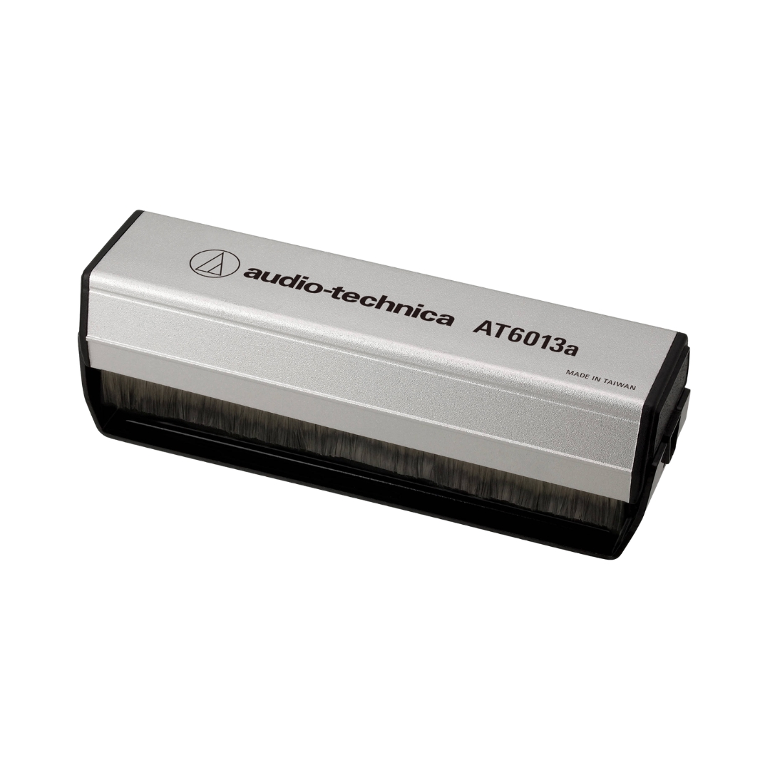 Audio-Technica AT6013a dual-action anti-static record brush for cleaning vinyl records and reducing static buildup.