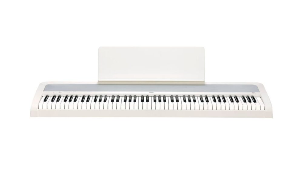 Elegant white Korg B2+ digital piano equipped with 88 hammer action keys for realistic touch and sound.