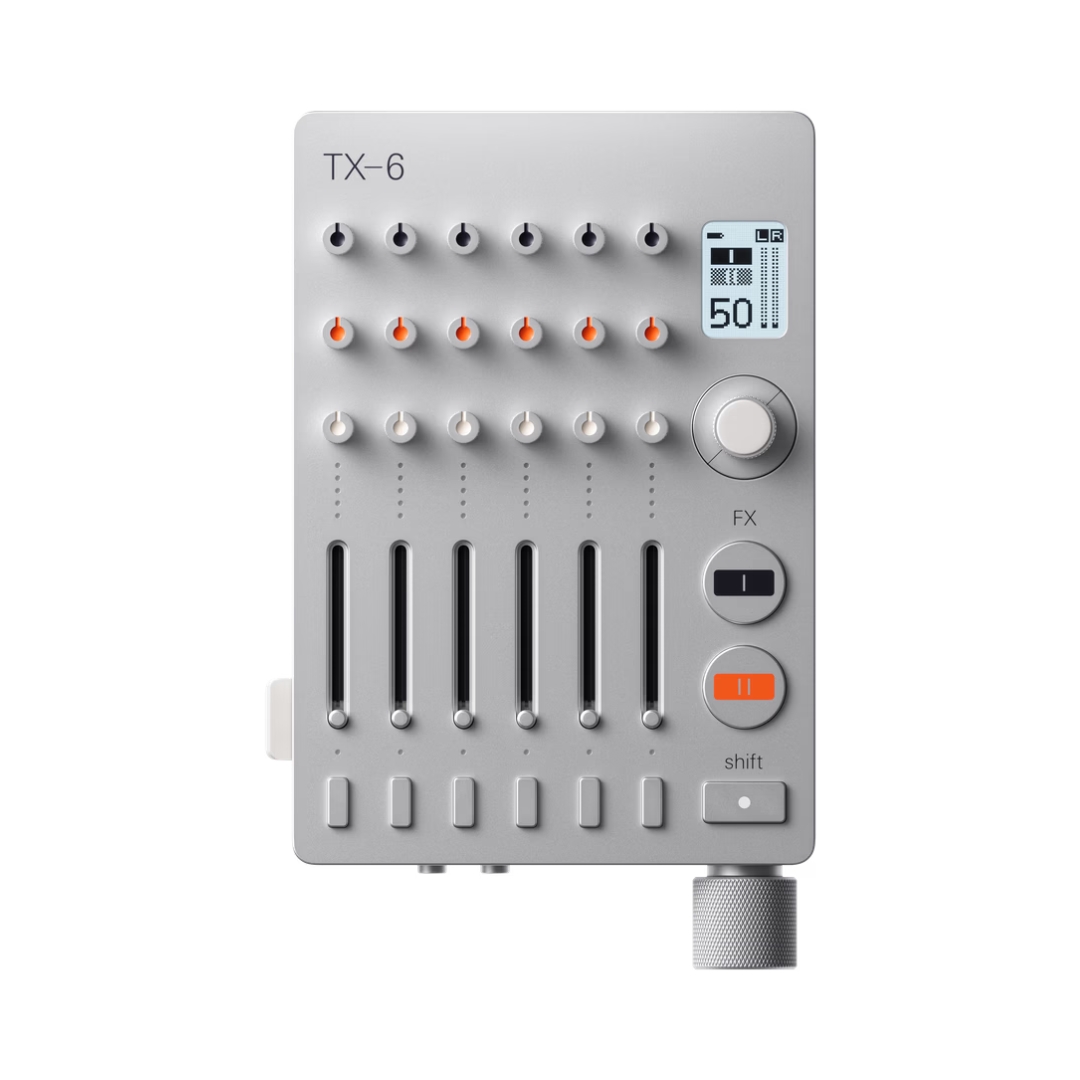 Silver Teenage Engineering TX-6 portable 6-channel pro mixer with sleek design and intuitive controls for audio mixing.